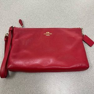 Red Coach wristlet with zipper and inside pocket